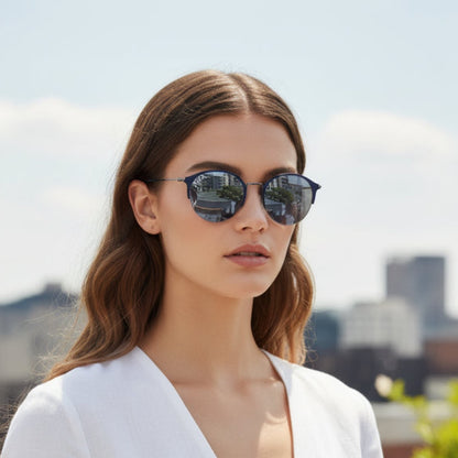 Oval sunglasses with a dark blue metal  frame, silver metal temples, and gradient gray-blue lenses, shown on a plain white background.